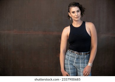 Serious portrait of a stylish woman with interesting hair style, lgbtq lifestyle  - Powered by Shutterstock