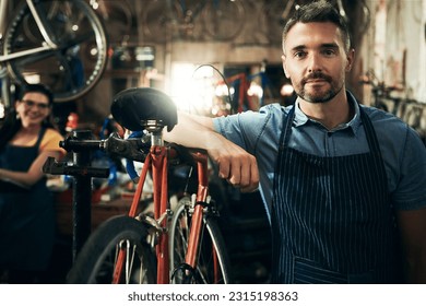 Serious, portrait and technician man in bicycle shop working in store or cycling workshop for repair. Face, bike mechanic and confident male person, business owner or mature professional with pride - Powered by Shutterstock