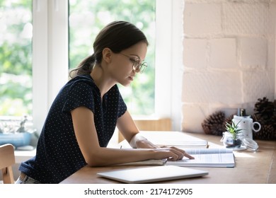 Serious Pretty Student Girl In Glasses Reading Book, Studying Paper Textbook, Focused On Text, Pointing Finger At Page, Preparing Report For Class, Lesson, Learning Presentation