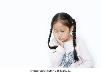 Serious And Sad Asian Little Child Girl With Posture Her Hand On Cheek Isolated Over White Background.