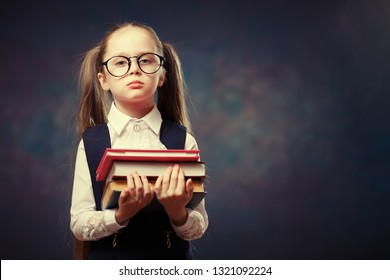Serious Schoolgirl Wear Glasses Hold Pile of Book. Color Tone - Shutterstock ID 1321092224