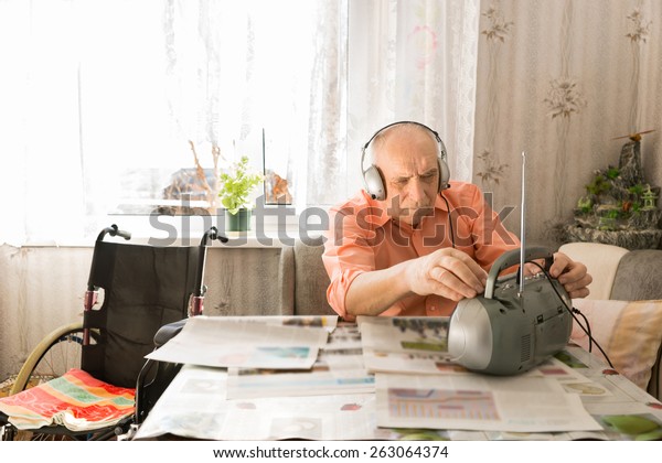 serious-senior-bald-man-listening-600w-263064374.jpg