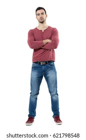 Serious Skeptical Young Man With Crossed Arms Looking At Camera.  Full Body Length Portrait Isolated Over White Background.