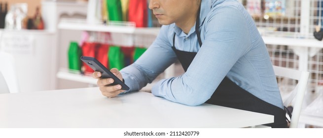 Serious Or Stressful Business Grocery Store Owner Using Smartphone, Entrepreneur Male Working Seriously In Store