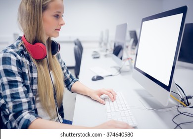 Serious Student Working On Computer At University