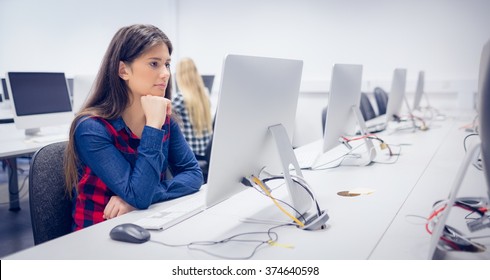Serious Student Working On Computer At University