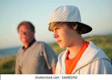 Serious Teen With Father