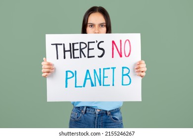 Serious Teen Girl Enviromental Activist Holding A Banner With There Is No Planet B Text Against A Green Background. Focus On Banner