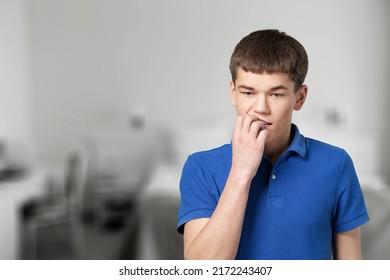 Serious Teen Pose Alone In Living Room. Adolescence, Difficult Personality, Bad Temper, Young Generation