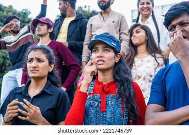 Serious tensed audience watching cricket sports match at stadium by biting nails - concept of tournament, championship and hopeful - Powered by Shutterstock