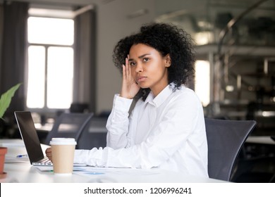 Serious Thoughtful African Business Woman Sitting At Office Desk With Laptop Looking Away Thinking Of Problem Solution, Pensive Millennial Black Female Searching New Idea At Work Lost In Thoughts