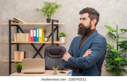 serious unshaven boss wear suit in the office with copy space, charisma