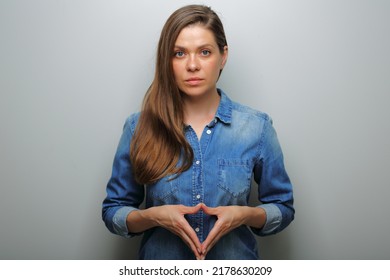 Serious Woman In Blue Casual Denim Shirt. Isolated Female Portrait.