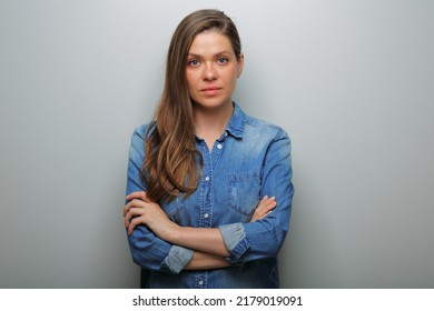 Serious woman in blue casual denim shirt with arms crossed. isolated female portrait. - Shutterstock ID 2179019091