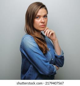 Serious Woman In Blue Casual Denim Shirt. Isolated Female Portrait.