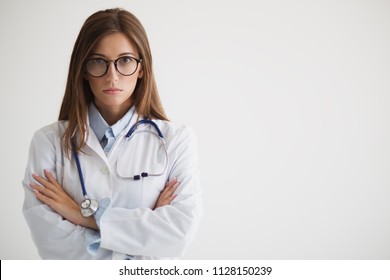 Serious Woman A Doctor With Glasses Folded Her Arms Near Her Breasts