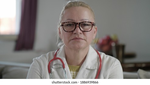 Serious Woman Doctor Wearing White Stethoscope Uniform Consulting Patient Online Via Video Call Watching Camera Talking Camera, Remote Video Chat, Telemedicine And E-health Concept, Webcam. Online