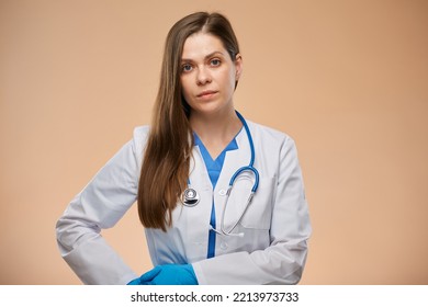 Serious Woman Doctor In White Coat Wearing Blue Gloves. Isolated Portrait.