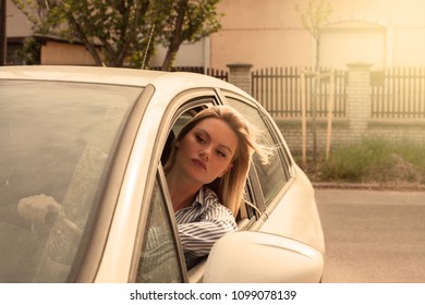 Serious Woman Driving Car.