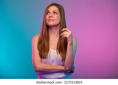 Serious Woman Looking Up, Portrait With Neon Lights Colors Effect. Female Model On Neon Background