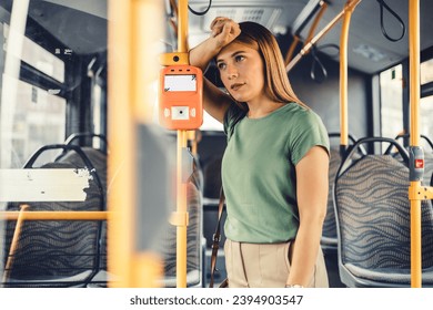 Serious woman in train or bus looking through the window. Thoughtful passenger in public transportation. Upset lady traveling. Pensive woman traveling with public transport. - Powered by Shutterstock