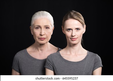 Serious Women Looking At Camera, Young And Senior People Isolated On Black