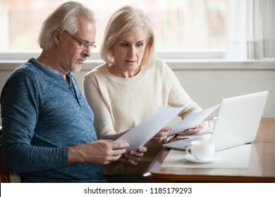 Serious worried senior couple calculating bills to pay or checking domestic finances stressed of debt, retired elderly old family reading documents concerned about loan bankruptcy money problems - Powered by Shutterstock