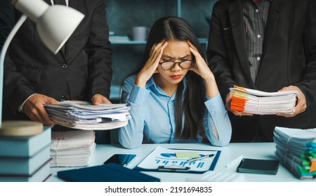 Serious Young Asian Female Business Overtime Work At Desk In Office At Night.