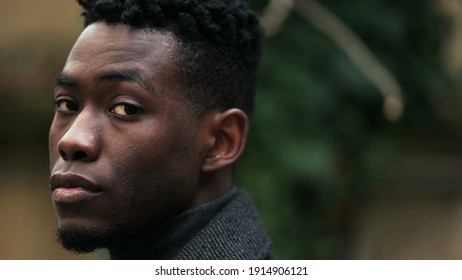 Serious Young Black Man Standing Outdoors. Stoic Handsome African Person