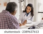 Serious young doctor woman writing down patients complaints, listening to older man visiting practitioner office, giving medical consultation, recommendation for checkup, treatment