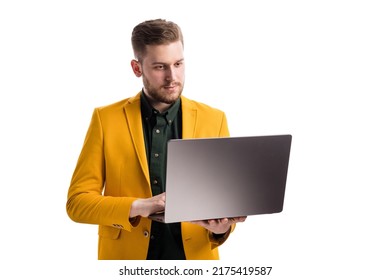 Serious young guy typing on portable laptop over white studio background. Bearded handsome man looking at screen and working in corporate network. - Shutterstock ID 2175419587