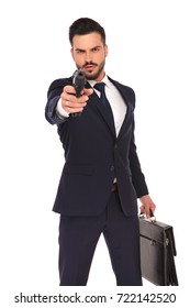 Serious Young Hitman Pointing And Aiming His Gun To The Camera On White Background