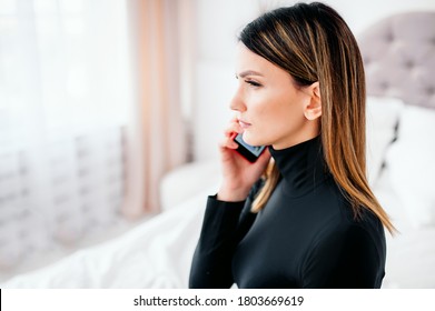 Serious Young Woman Focused On Receiving Information During A Telephone Conversation, Pensive Girl Calling A Friend