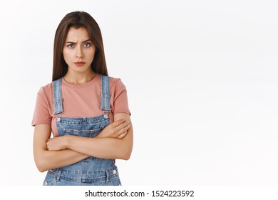 Serious-looking Bossy And Skeptical, Annoyed Girlfriend Demand Explanations Staring Camera Angry And Pissed, Cross Hands Over Chest, Standing Over White Background Focused