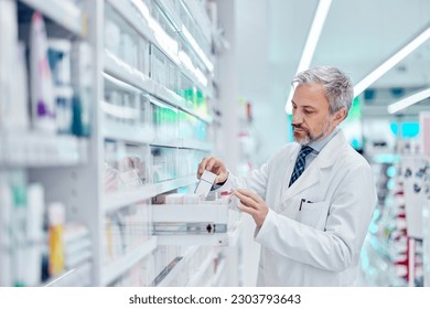 Serious-looking man, taking a medicine from the drawer. - Powered by Shutterstock