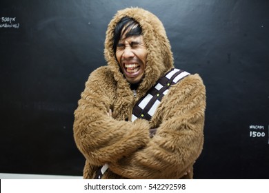 Seriously, Funny Eskimo Man Sneeze Breathing And Crying In Vintage Style Look Portrait.