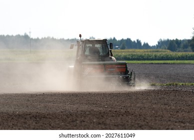 Serock, Poland - September 14, 2020: Tractor With Grain Seeder In The Field. Sowing Grain In The Field, Cultivating Cereals.