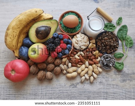 Serotonin, dopamine and brain boosting foods. Assortment of food for good mood, happiness, better memory, positive mind. Healthy foods that may help boost serotonin. Natural food sources of serotonin.