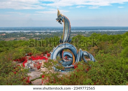 Serpants and snakes in Wat Roi Phra Putthabat Phu Manorom, Mukdahan City, Thailand. Thai buddhist temple architecture. Tourist attraction landmark.