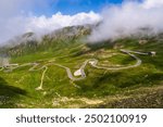 Serpentine high mountain road in  beautiful Alpine mountains covered with green vegetation Hohe Tauern. Hochalpenstrasse.  Grossglockner High Alpine Road. Austria. High quality photo