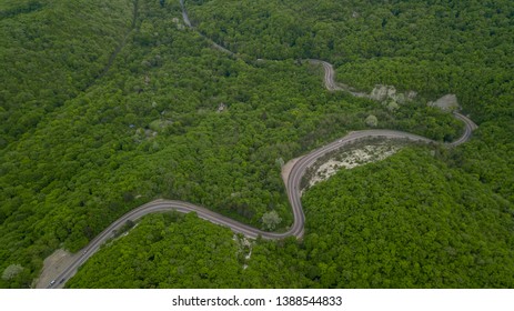 Serpentine Road Among Green Hills of Peak Caucasian Mountains, Russia