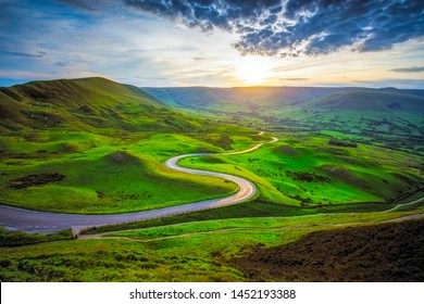 Serpentine Road Among Green Hills Of Peak District National Park In Uk.