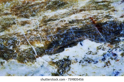 Serpentine Subgroup Mineral Stone Macro View. Greenish Brownish Color Polymorphs Asbestos Gem Background.