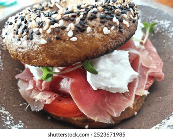 Jamón serrano bagel with cream cheese iberic ham bagel with sesame seeds and cheese gourmet food breakfast lunch or diner  - Powered by Shutterstock