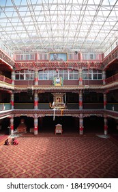 Sertar County, Sichuan, China - May 16, 2014: View Of Academy Building Interior With Lama Sitting On The Floor At The Serta Larung Five Science Buddhist Academy In Sertar County, Sichuan, China. 