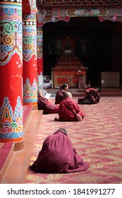 Sertar County, Sichuan, China - May 16, 2014: View Of Academy Building Interior With Lama Sitting On The Floor At The Serta Larung Five Science Buddhist Academy In Sertar County, Sichuan, China. 