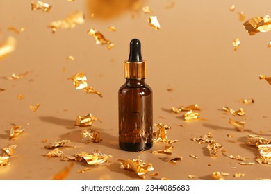 serum, essential oil in brown glass bottle with pipette, golden paper on golden background. cosmetology product for facial care, mockup, template - Powered by Shutterstock