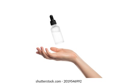 Serum hovering or flying over a woman's hand, isolate