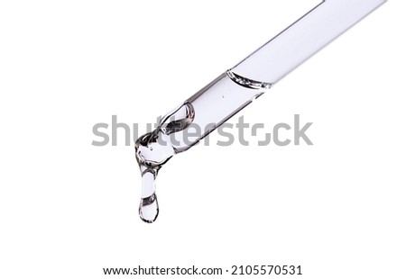 serum pipette with a falling drop on a white background	
