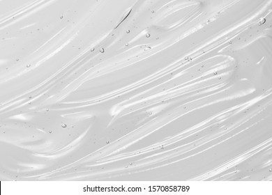 Serum texture, clear liquid gel background. Transparent beauty skincare product sample